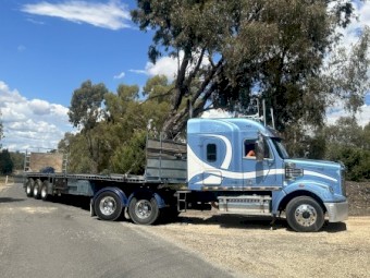 2013 Freightliner Coronado 122 with 1997 Freighter Flattop Trailer