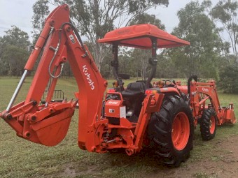 Kubota L4600 4WD Ultimate Package including 4 in 1 bucket, backhoe with hydro thumb, slasher, post driver, shade hood and pallet forks