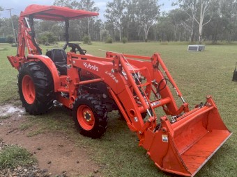 Kubota L4600 4WD Ultimate Package including 4 in 1 bucket, backhoe with hydro thumb, slasher, post driver, shade hood and pallet forks