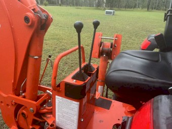 Kubota L4600 4WD Ultimate Package including 4 in 1 bucket, backhoe with hydro thumb, slasher, post driver, shade hood and pallet forks