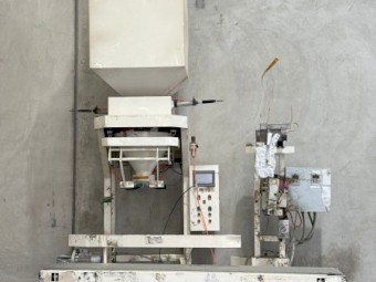 Semi automatic WPP bagging machine with load cells and weigh scale.