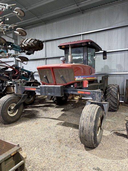 MacDon 9352i Windrower with 30ft 972 Front on Trailer