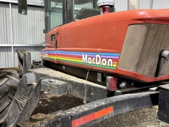 MacDon 9352i Windrower with 30ft 972 Front on Trailer