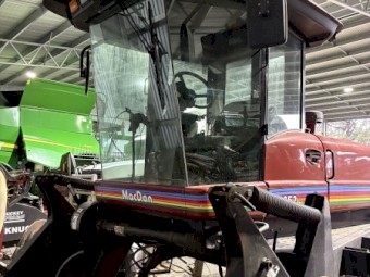 MacDon 9352i Windrower with 30ft 972 Front on Trailer
