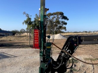 Munro post driver with manitou quick hitch.