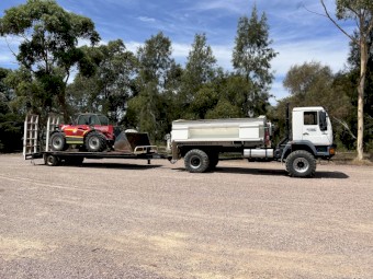 MAN spreader with trailer and loader