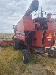 International 1420 axial flow header w John Deere front