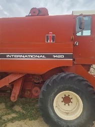 International 1420 axial flow header w John Deere front